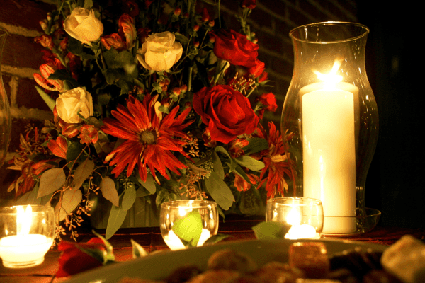 Floral centerpiece and white candle